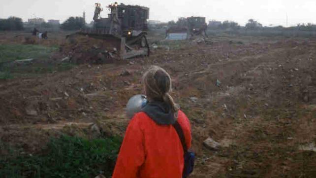 March 16, 03. Rachel nonviolently blocks Israeli bulldozers from destroying Palestinian homes along the Rafah/Egyptian border